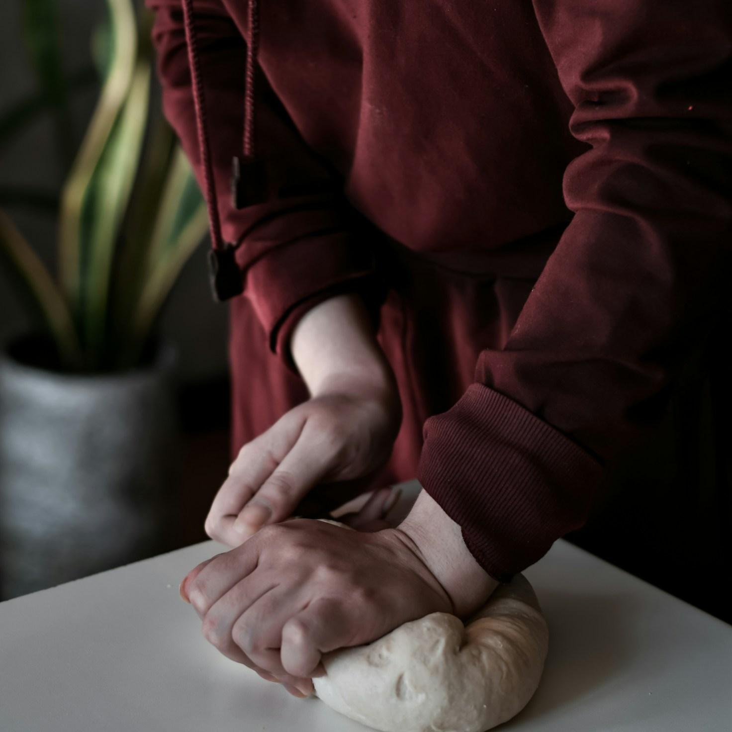 Participants collaborating in a contemporary kitchen, exchanging recipes and techniques